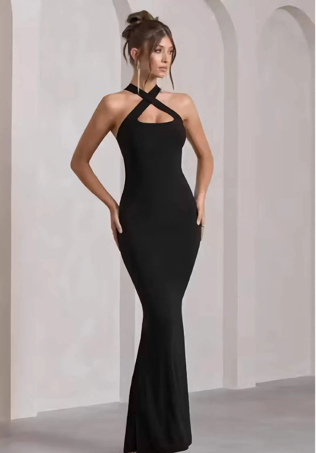 Side view of sleeveless black bodycon full length dress for women