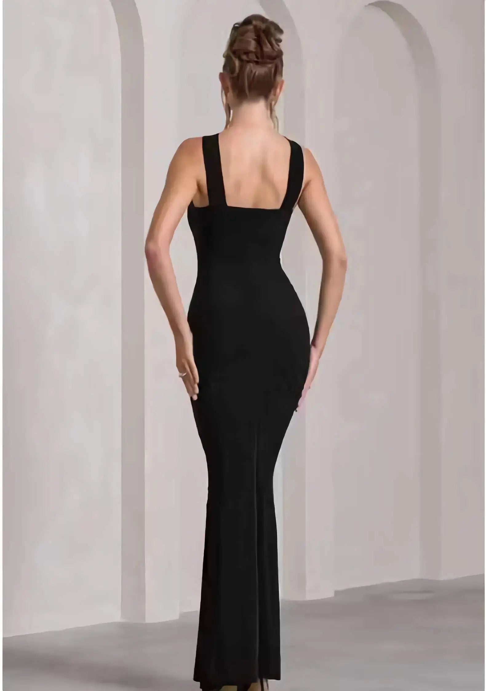 Back view of sleeveless black bodycon full length bodycon dress
