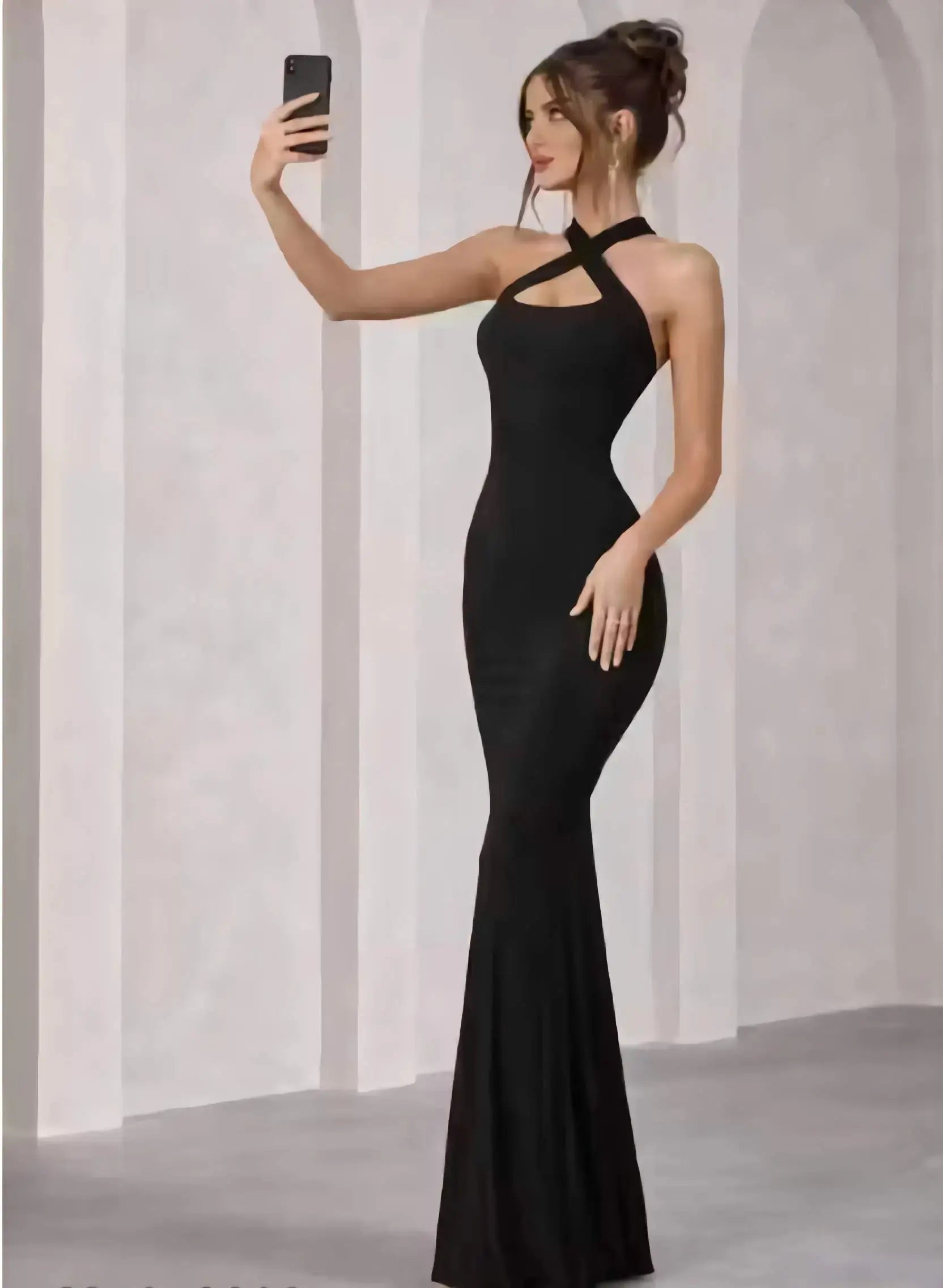 Side view of sleeveless black bodycon full length dress for women