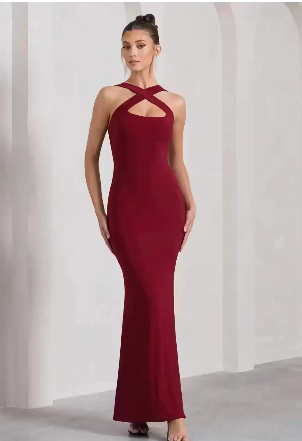 Side view of sleeveless maroon bodycon full length dress for women