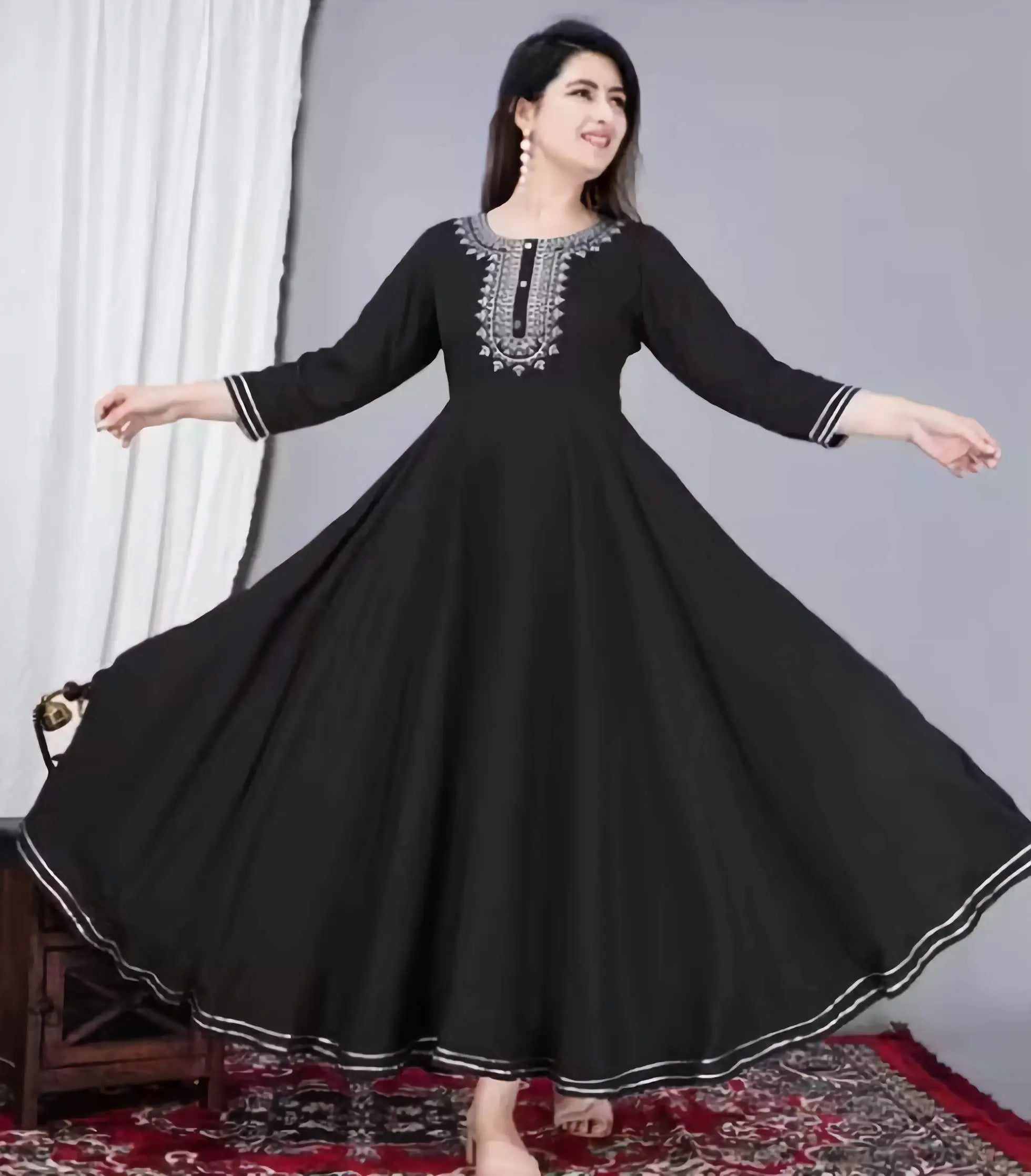 Black women Anarkali kurti made from soft rayon fabric with elegant embroidered neckline